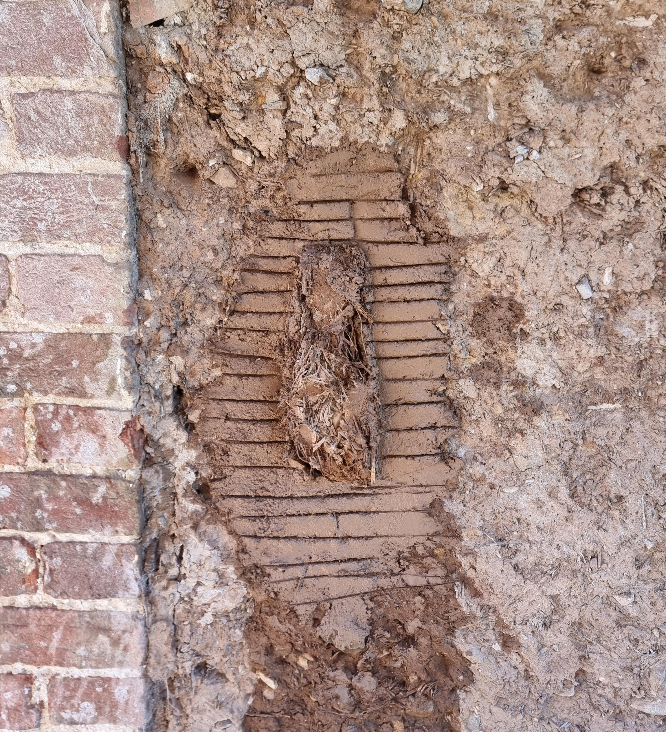 Cob block repair, replacing brick.